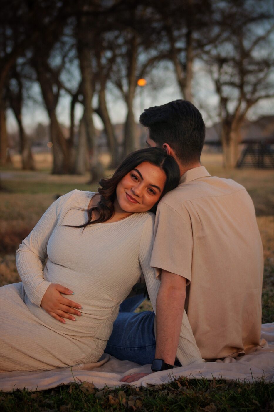 Couple sitting together at sunset
