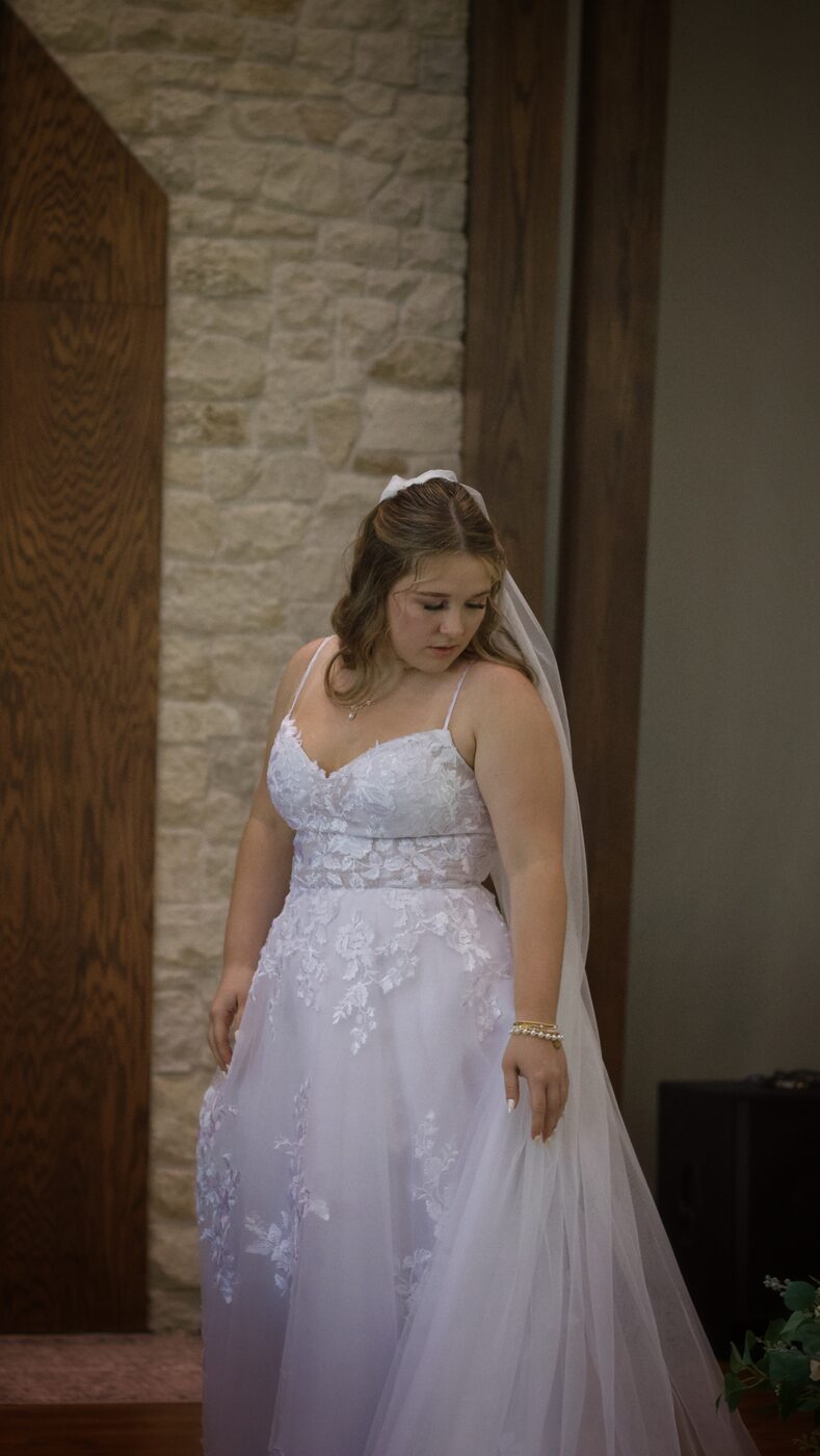 Bride walking down the aisle alone